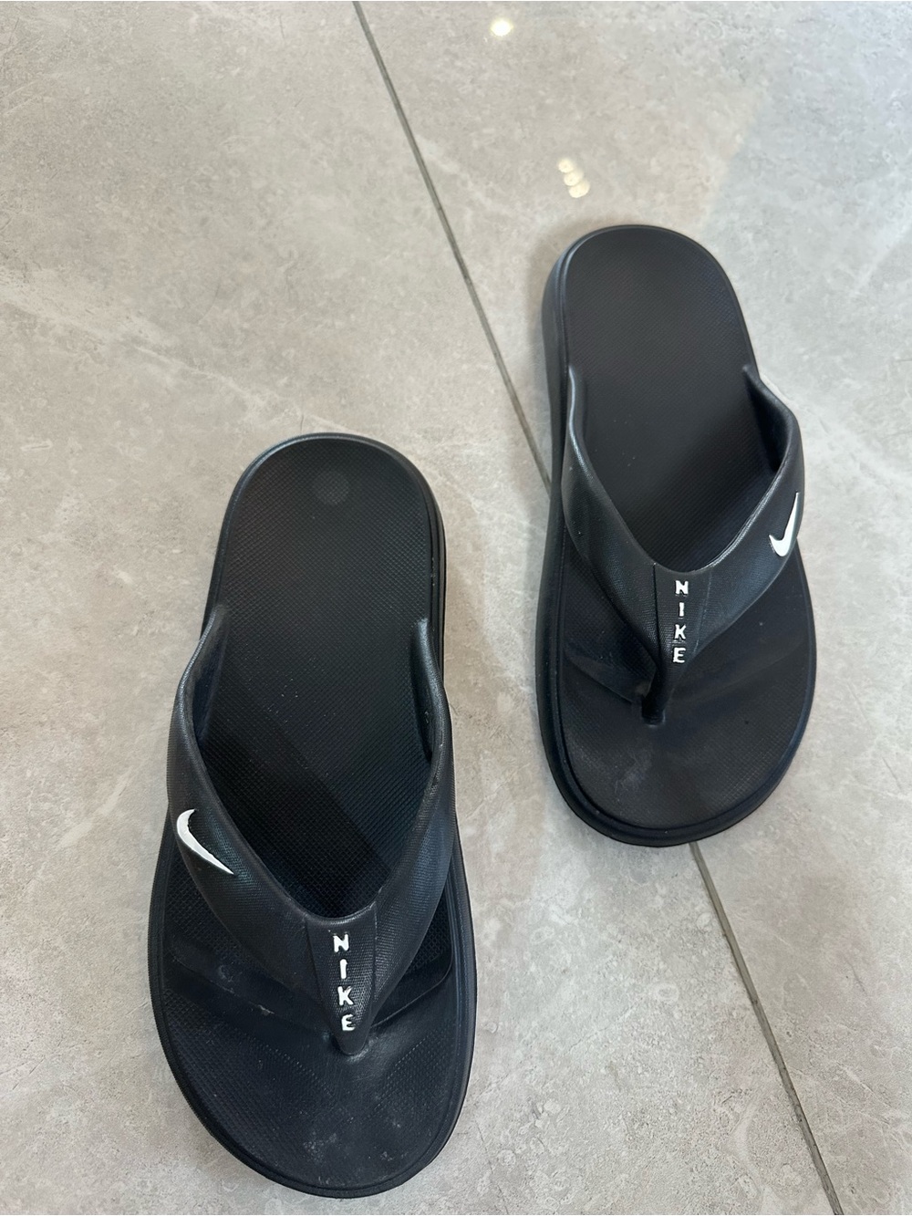 Nike Black Flip-Flop Sandals with White Swoosh Accent